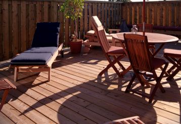 Contractors securing decking tiles during a Trex decking installation in a Glendale backyard.